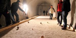 Playing boules in the underground fortress on Goli Vrh